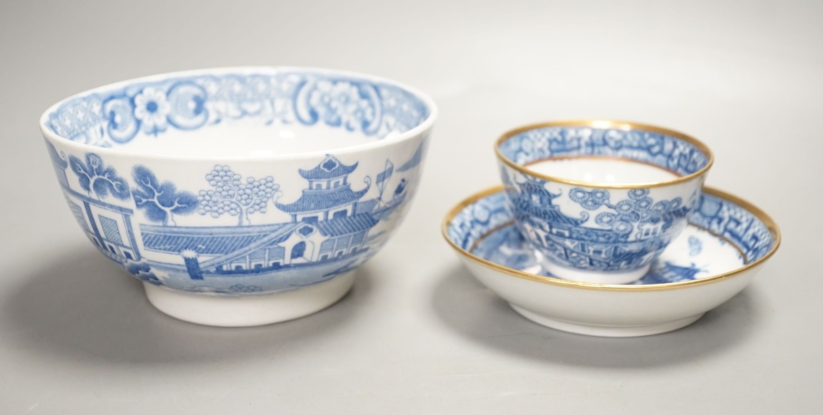 A New Hall slops bowl printed with the 'Duck' pattern and a teabowl and saucer printed with the 'Moth' pattern c.1790, Slops bowl 15.5 cms diameter.